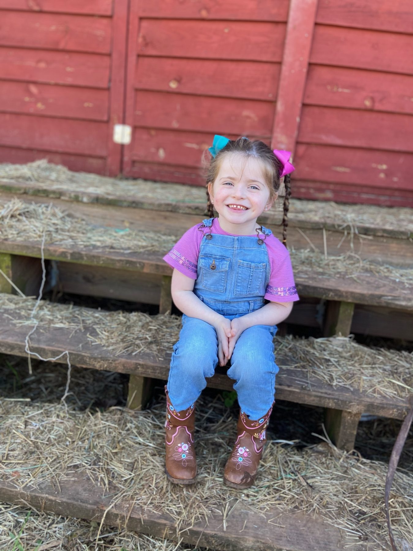 A young camper on the hay