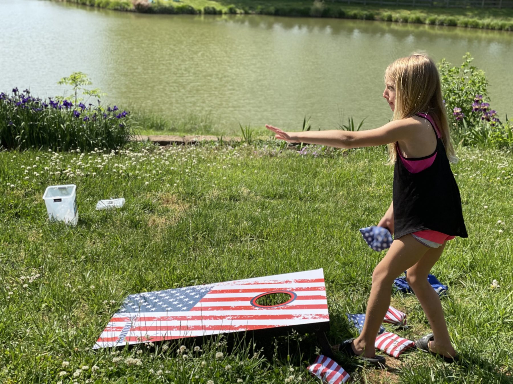 Cornhole by the pond